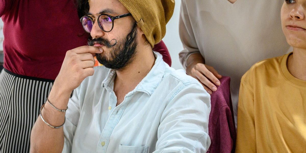 A team of professionals collaborating intently, highlighting the skill and consistency required for high-quality data annotation to prevent AI hallucinations.
