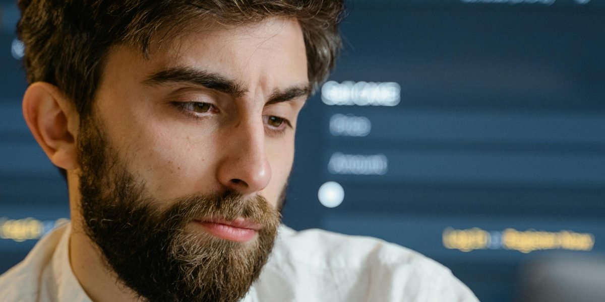 A person deeply focused on data analysis, representing the critical process of validating AI outputs against trusted annotation data using secondary analysis techniques.