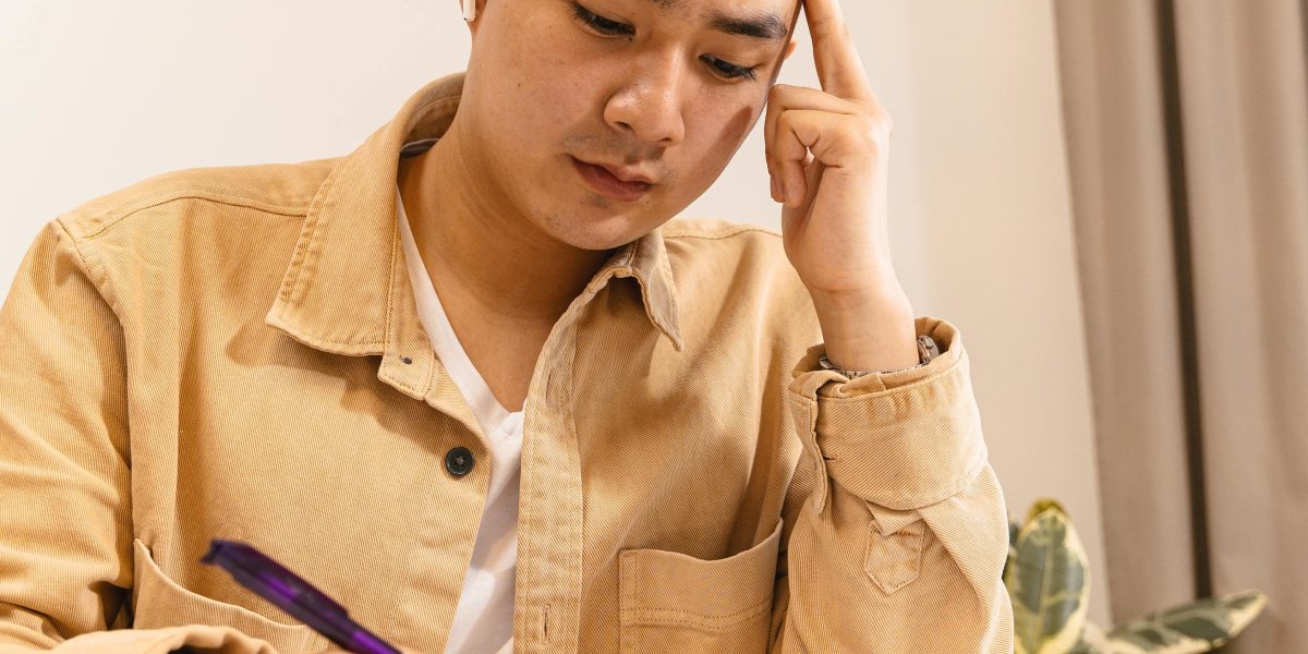 An individual focusing intently on learning complex new technical skills.