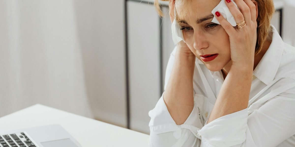 A person looking stressed or concerned, symbolizing the negative outcomes of relying on hallucinated AI information.