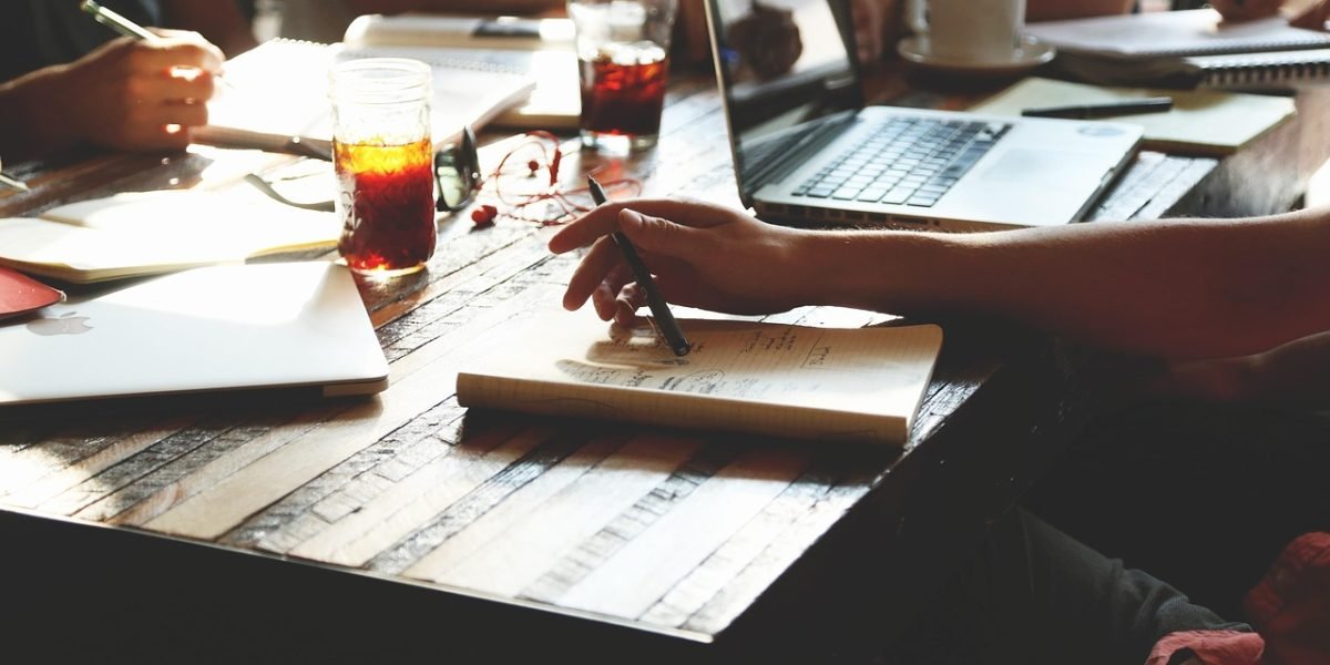 A diverse group of individuals actively sharing ideas and insights in a collaborative setting.