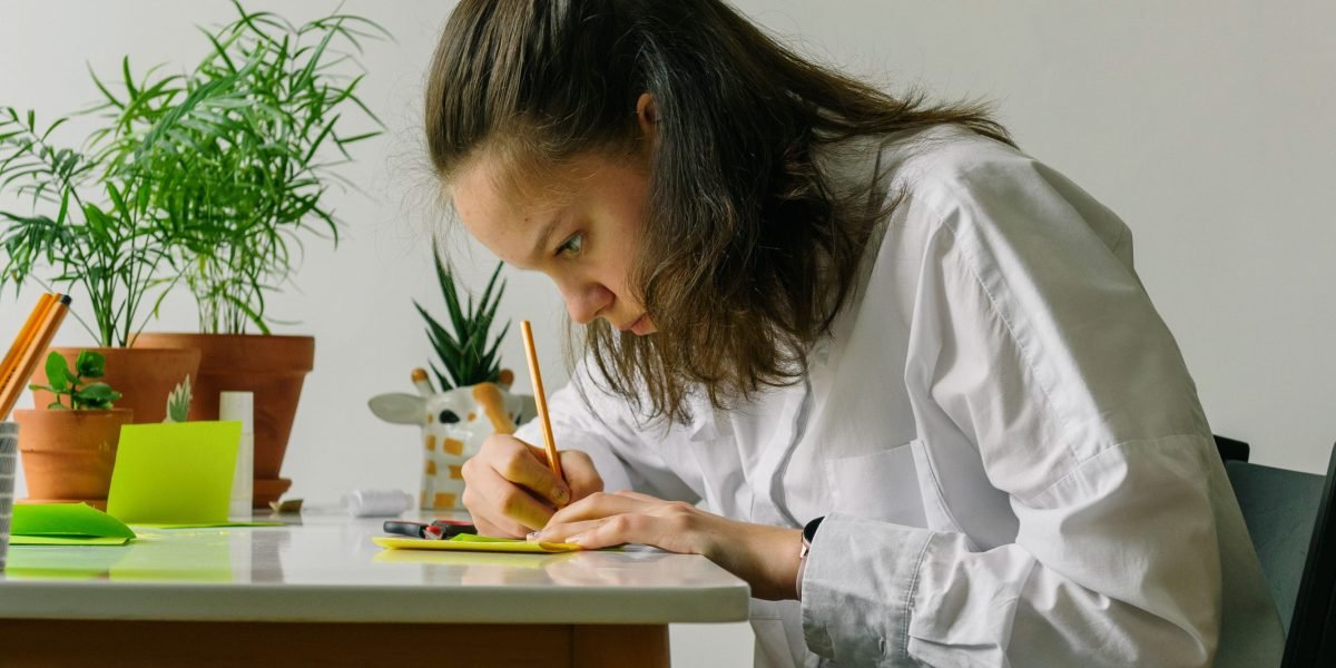 An individual deeply focused on learning, reflecting the continuous skill development required for an AI engineer.