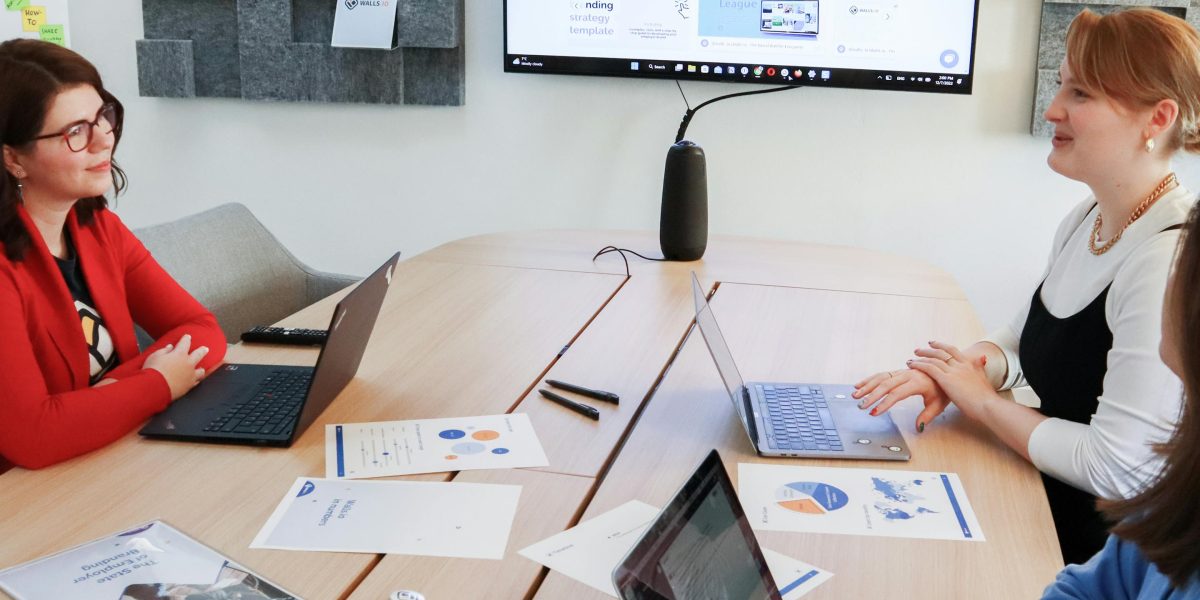 A marketing team collaborates, leveraging AI tools to enhance their creative and strategic output.