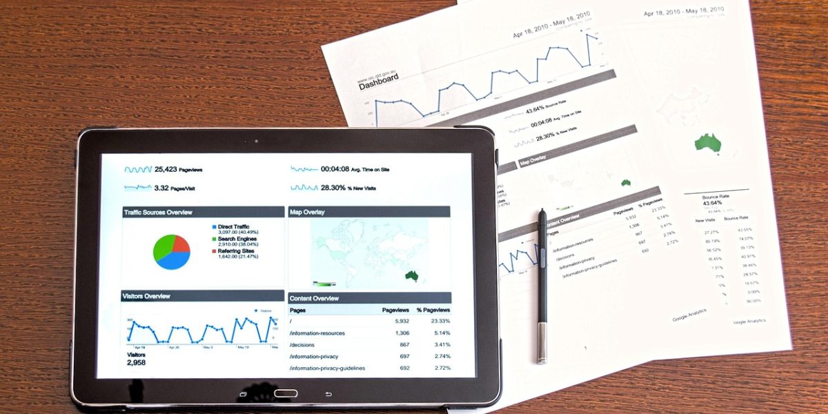 A professional reviews data reports on a tablet, showing confidence in understanding complex metrics.