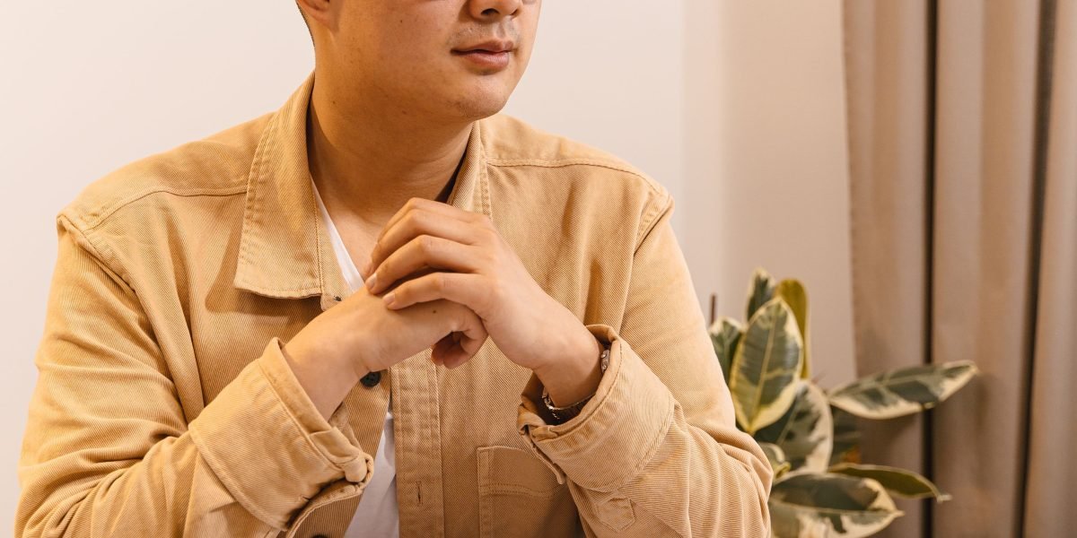 A person thoughtfully considering information, perhaps with a skeptical or questioning expression, symbolizing the need for critical evaluation of AI outputs.
