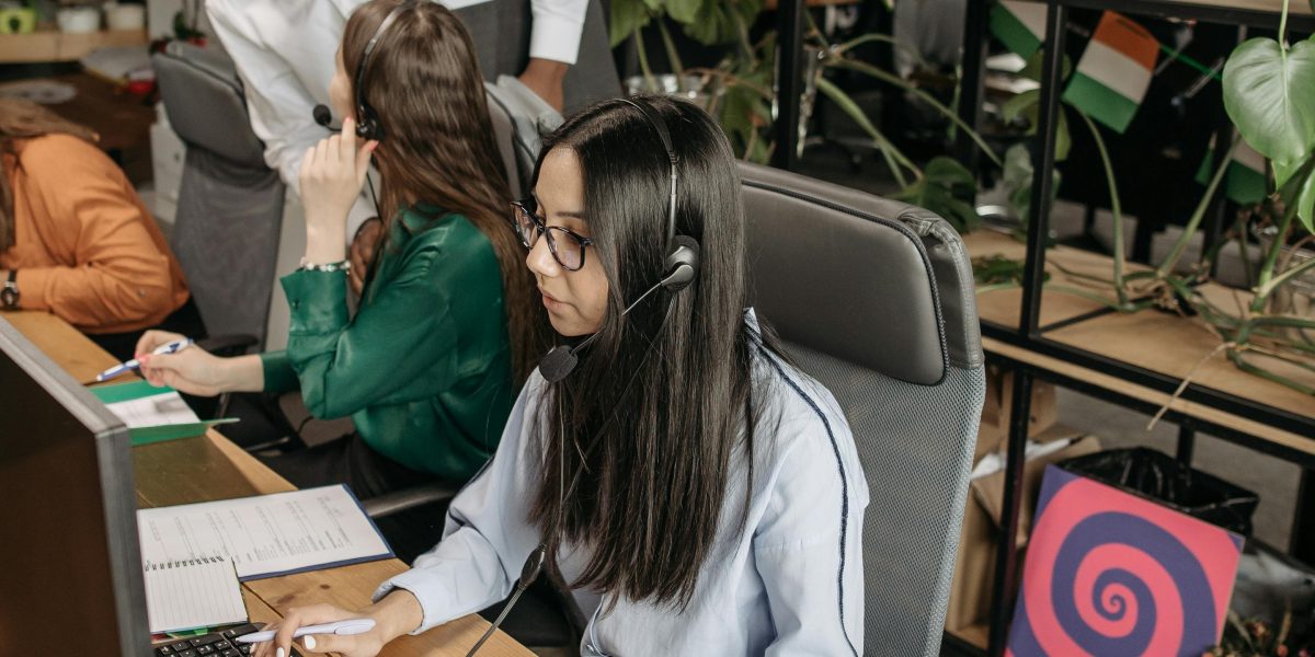 A team of professionals collaborating in a modern security operations center, reflecting the teamwork in cybersecurity roles.