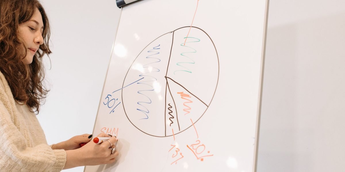 A person presents data visualizations on a screen, clearly communicating complex information with charts and graphs.