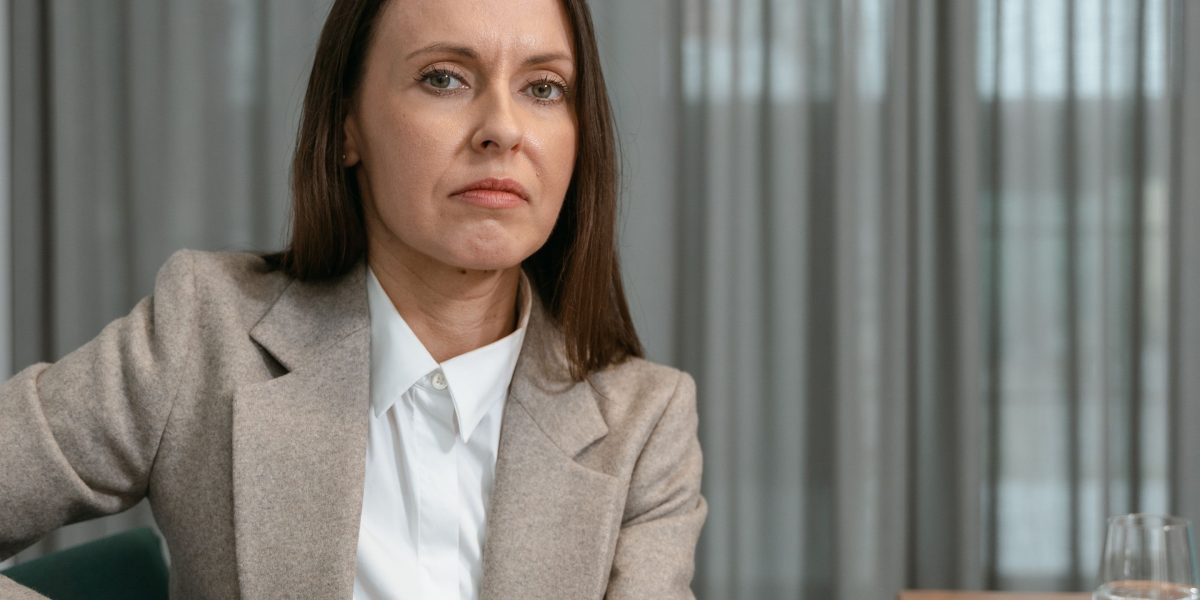 A business leader looks concerned while reviewing documents, reflecting the high stakes of AI application.