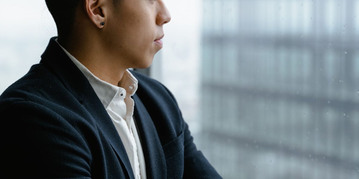 Professionals in a modern office, looking ahead with confidence, representing a forward-thinking approach to AI.