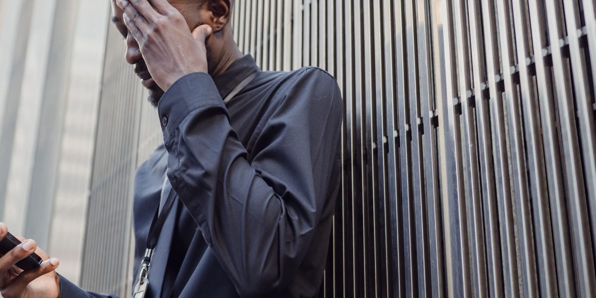 A person looking thoughtful or concerned, representing the risks of AI inaccuracy to business.