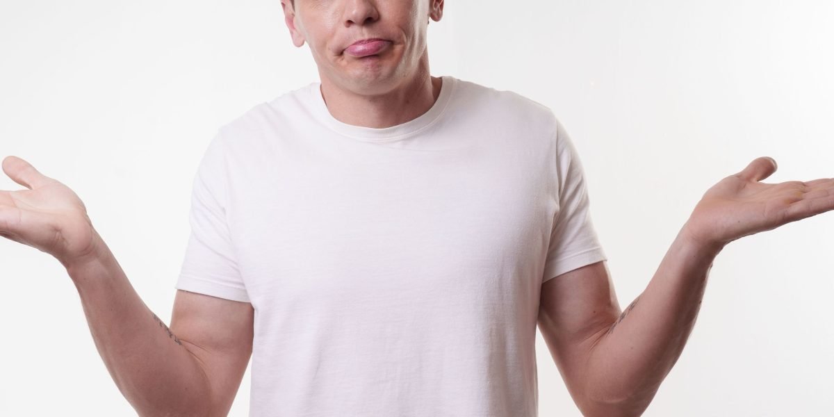 A person looks closely at a digital image, showing surprise or confusion at a subtle error.