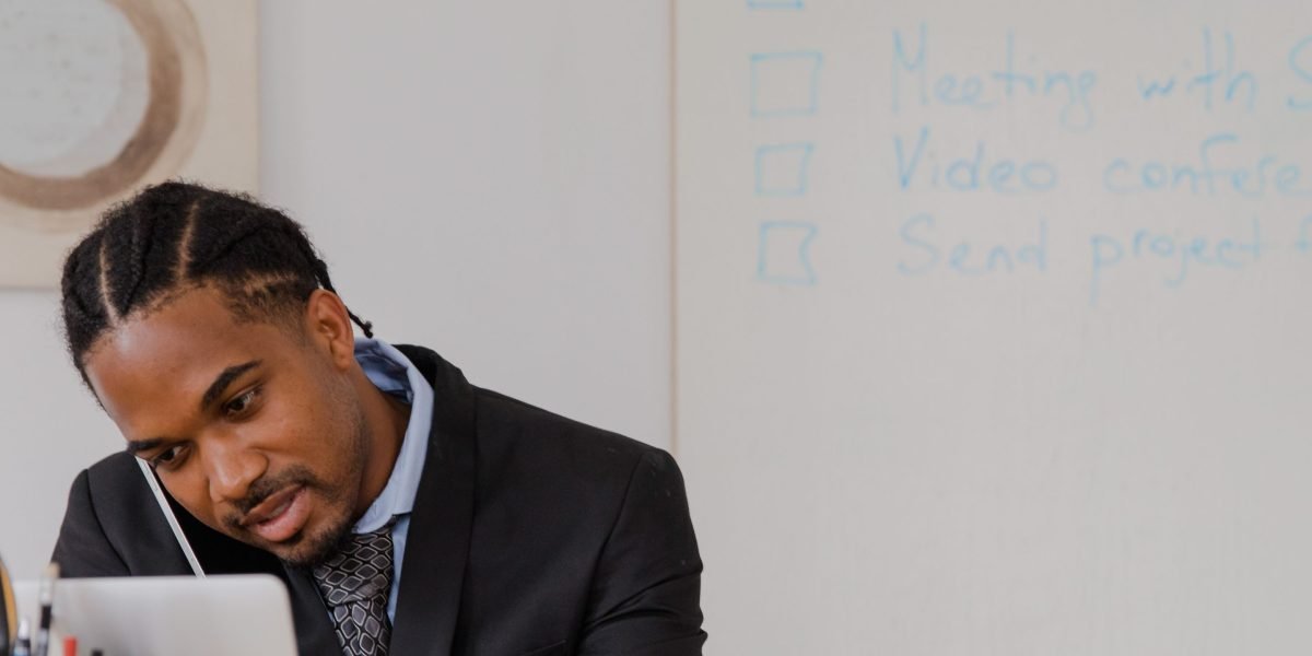 A small business owner looks confused while reviewing website content, reflecting the hidden risks of AI-generated information.