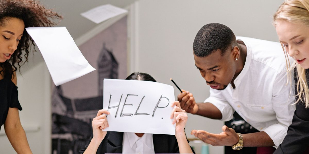 Business professionals in a serious discussion, representing the challenging conversations that arise from AI content errors and damaged trust.