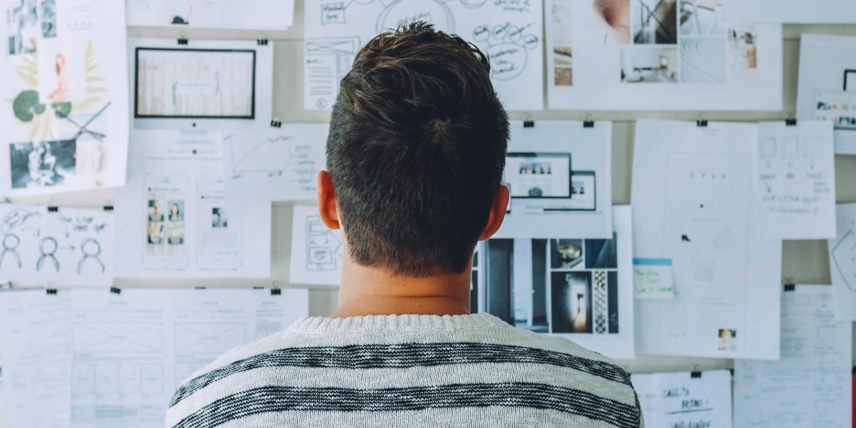 A person brainstorming, symbolizing the innovative opportunities AI brings to web design.