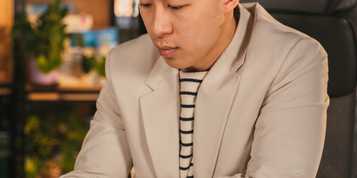 A marketing manager deeply focused on planning a complex digital advertising strategy in an office setting.