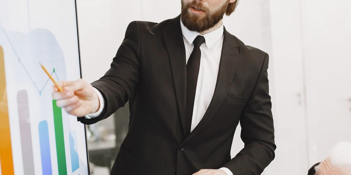 A confident business leader presenting to a group, symbolizing leadership in adopting future-proof data governance strategies.