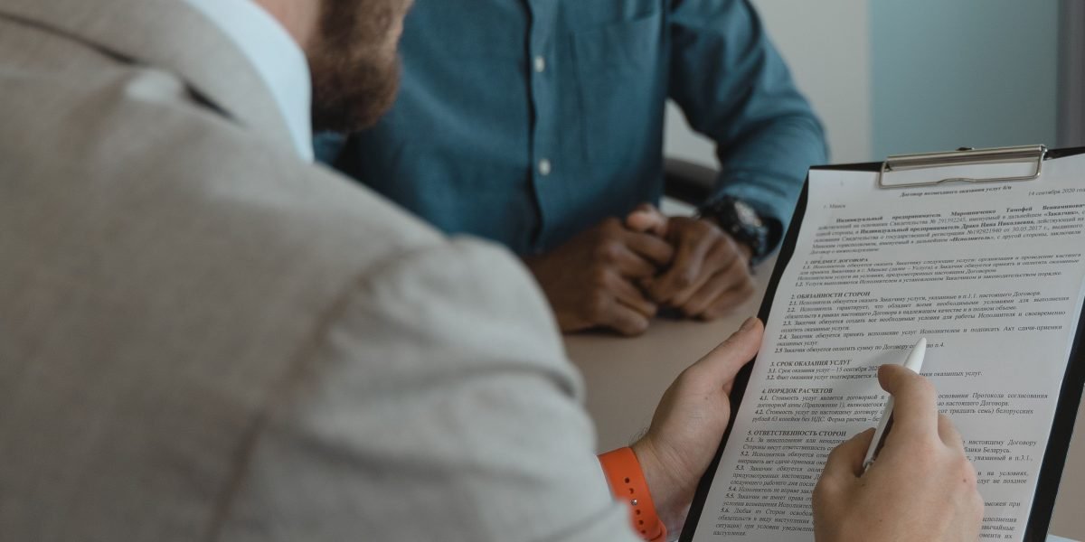 A professional thoughtfully evaluating different choices or data points, reflecting the process of comparing AI model performances.