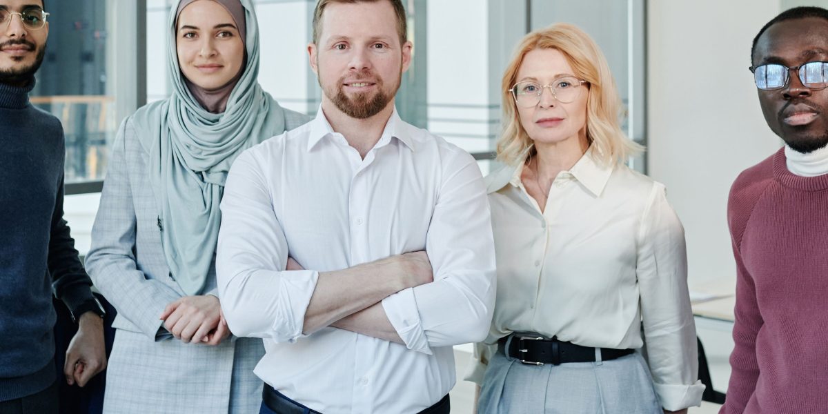 A diverse team collaborating and looking confidently towards the future, representing the positive outlook for trustworthy AI.