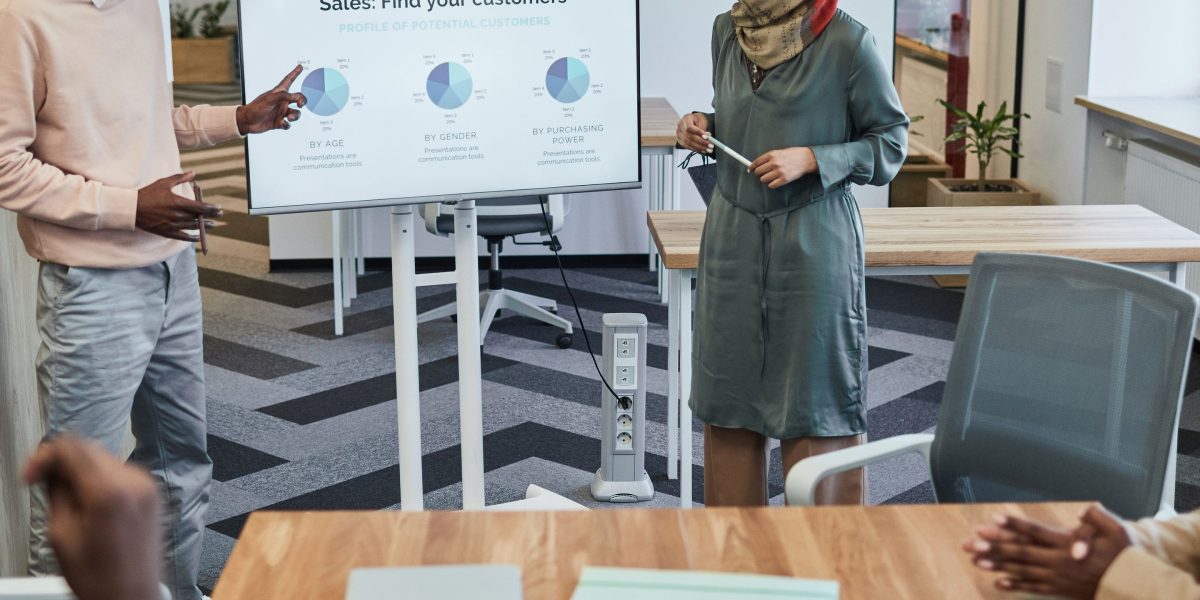 A diverse team engages in a focused discussion, strategizing how to adapt to significant workforce changes.