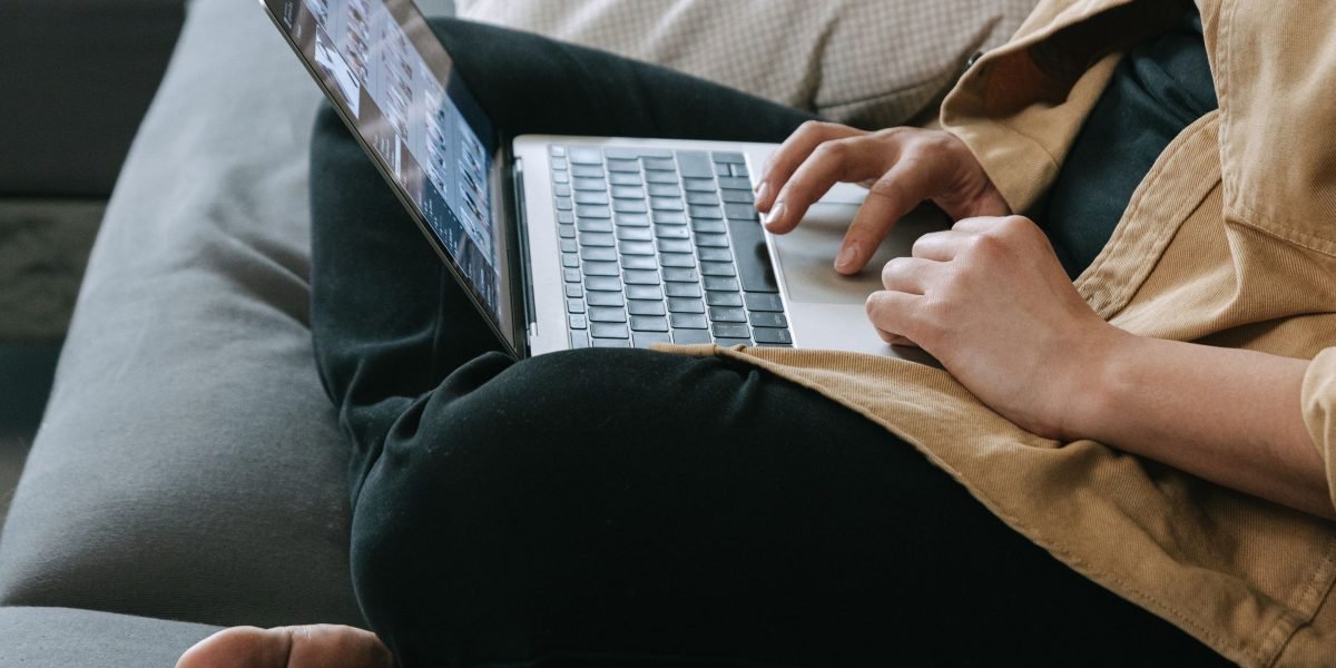 An individual working productively in a comfortable, flexible home office setting.